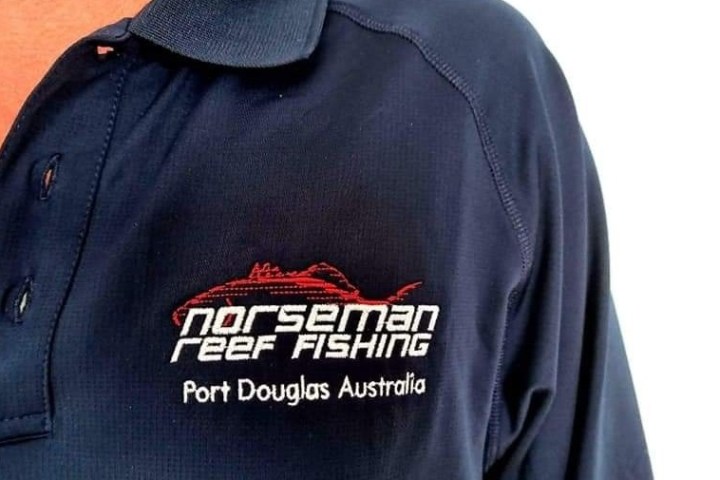 close up of a man wearing a polo shirt